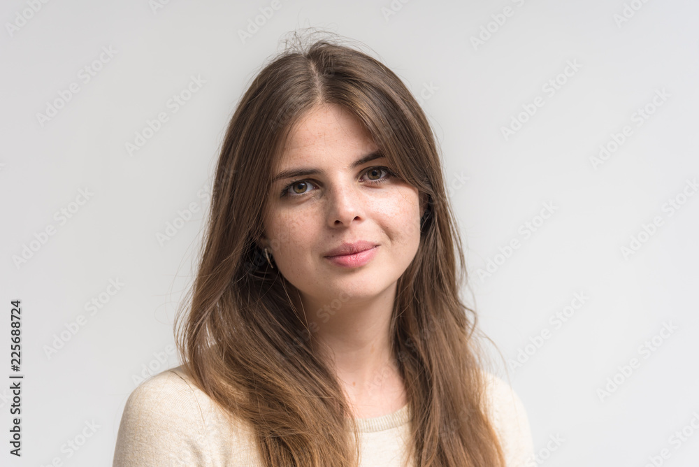 Portrait of a beautiful happy brunette girl on a white background. Portrait of a beautiful happy brunette girl on a white background.