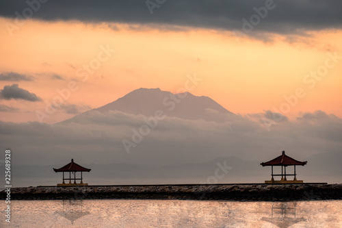 Mount volcano (Agung) with two pavilion on jetty