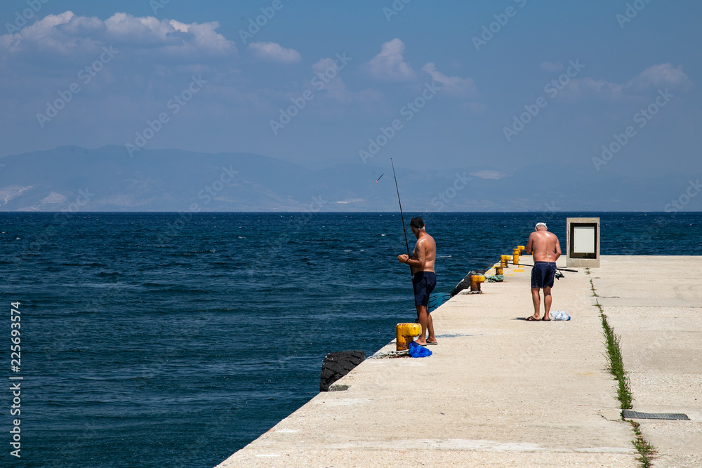 man fishing on the beach