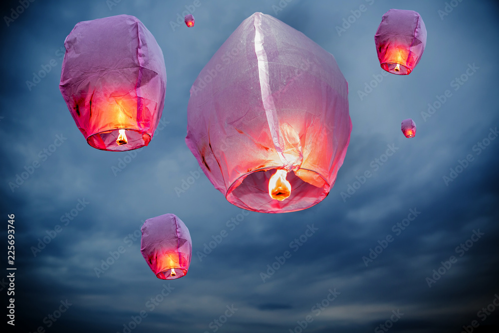 balloon fire Sky lanterns flying lanterns, hot-air balloons Lantern flies  up highly in the sky. Floating lanterns at dawn during Stock Photo | Adobe  Stock