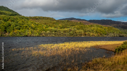 Stormy day at Loch Achray in autumn time photo