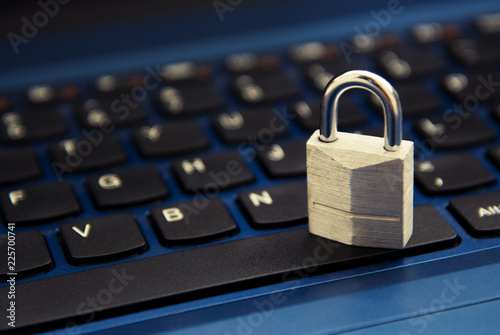 Cyber safety concept, padlock on laptop keyboard. Internet addiction. photo