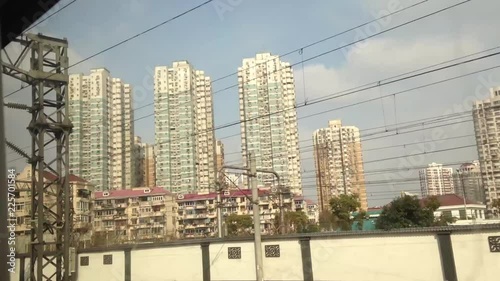 hopping on a Shanghai Maglev train to ShuZhou at late evening. looking out of the window staring at construction building. thinking of the speed of development in China. photo