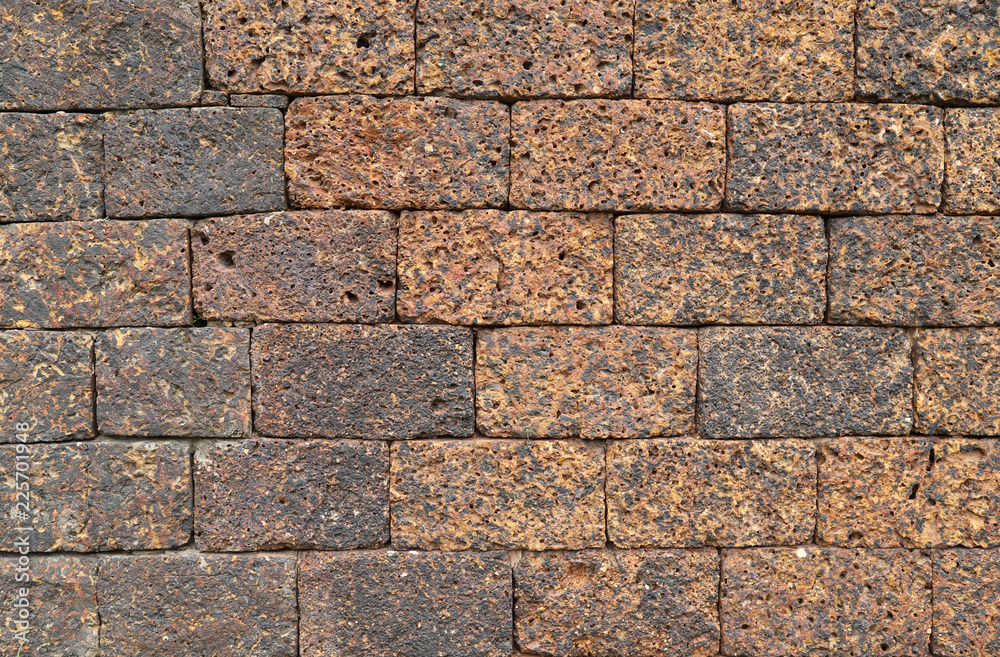 Fototapeta premium Closeup of old brown stone wall.