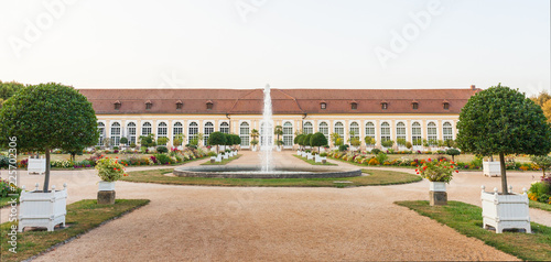 The main building of the Orangery and the fountain in the Central Park of Ansbach, Bavaria Germany photo