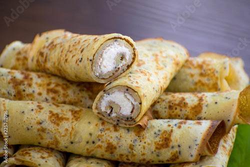 Pancakes rolls with cottage cheese. Pancakes with cheese. Shrovetide.