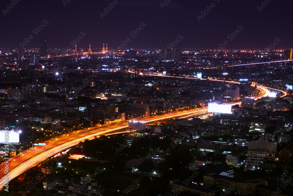 scenic of night cityscape with spped light tail on expressway