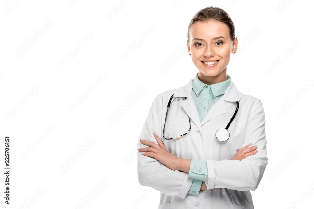 happy beautiful female doctor in medical coat standing with crossed arms isolated on white happy beautiful female doctor in medical coat standing with crossed arms isolated on white