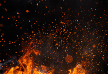 Fire sparks with flames on black background
