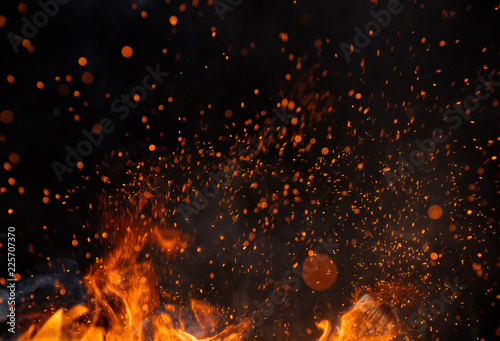 Fotografia Fire sparks with flames on black background