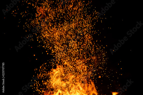 Fire sparks with flames on black background