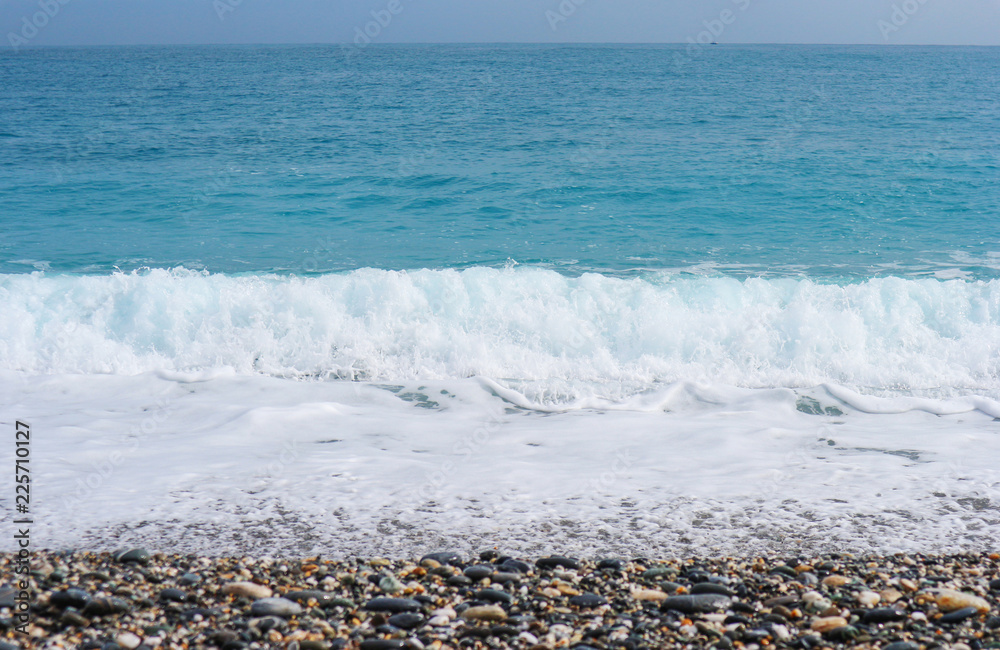 Natural splashing wave sea stone beach on sunny day at HUALIEN TAIWAN.