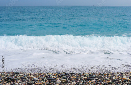 Natural splashing wave sea stone beach on sunny day at HUALIEN TAIWAN.