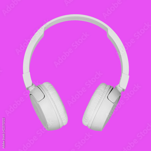 Headphones on modern pink backgrounds. Trendy colorful photo. bluetooth earbuds, white earphones. Music concept