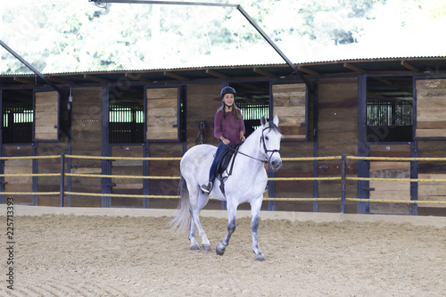 Beautiful Teenager Riding a Horse