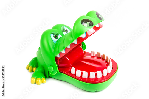 Alligator, green plastic crocodile toy on isolated