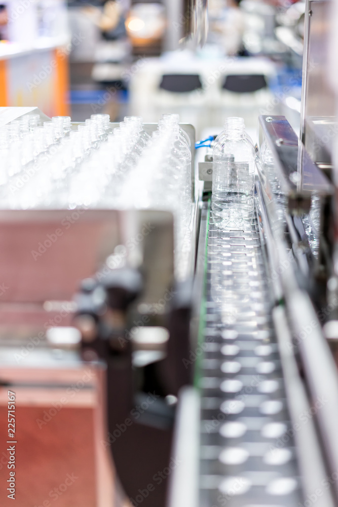 Manufacturing of bottles plastic line, bottle plastic hot blow process transportation raw material by automatic conveyor in the factory Manufacturing of bottles plastic line, bottle plastic hot blow process transportation raw material by automatic conveyor in the factory