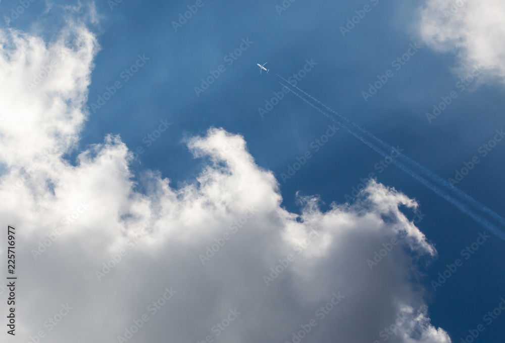 Commercial Airliner Flying Above Storm Clouds Commercial Airliner Flying Above Storm Clouds