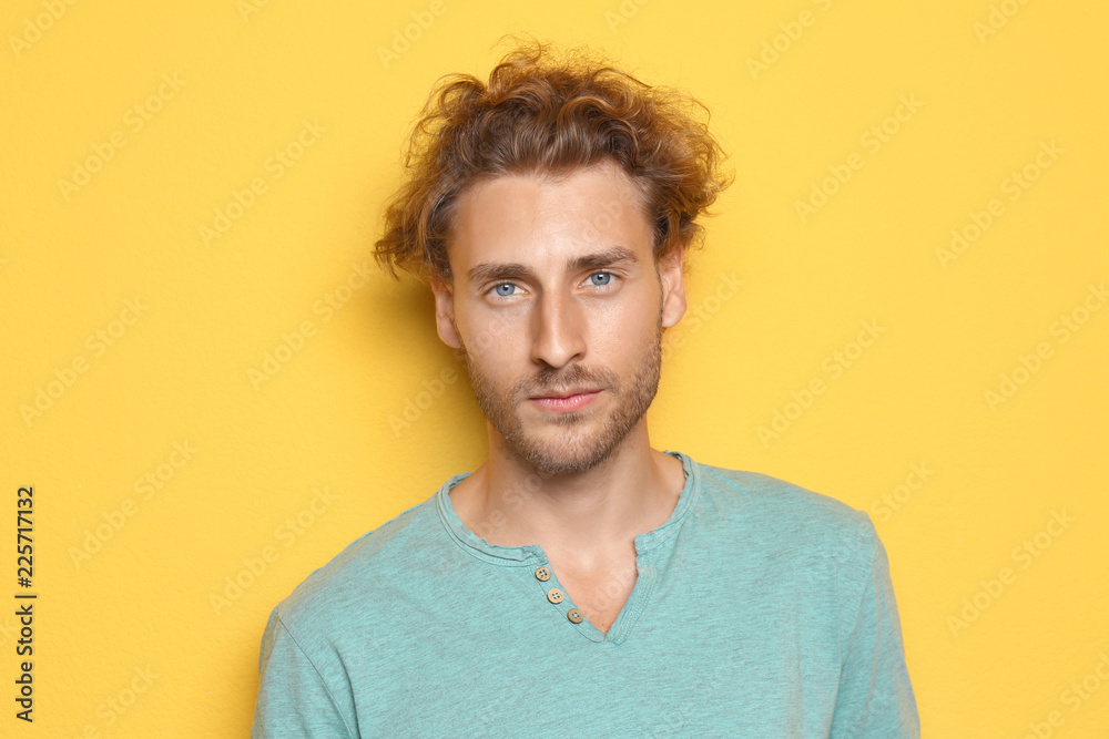 Fototapeta premium Portrait of young man on color background