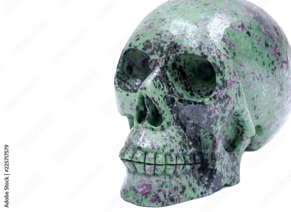 Ruby Zoisite realistic crystal carved skull isolated on white background Ruby Zoisite realistic crystal carved skull isolated on white background