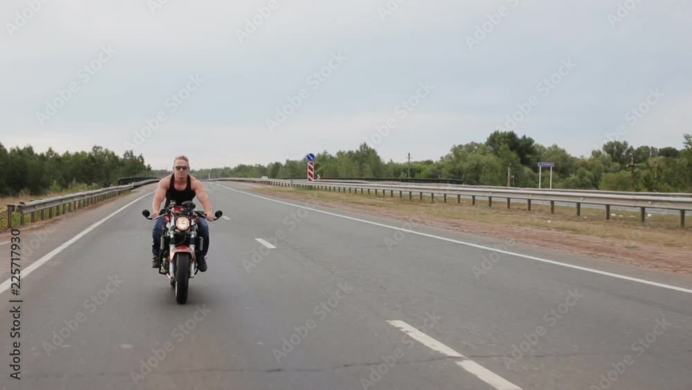 Theme of freedom.Man is riding a motorcycle on the highway. Theme of freedom.Man is riding a motorcycle on the highway.