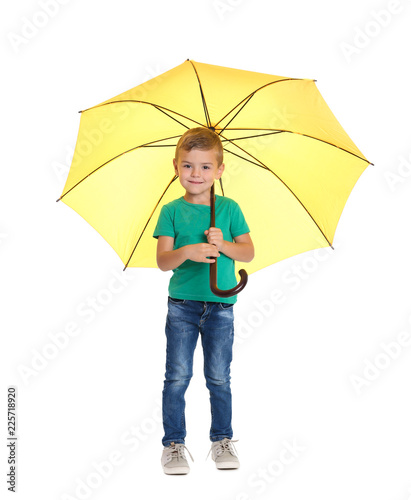 Little boy with yellow umbrella on white background
