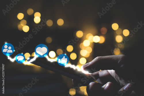 Man using smart phone on night. Social media concept.