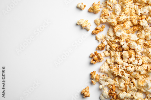 Delicious caramel popcorn on white background, top view