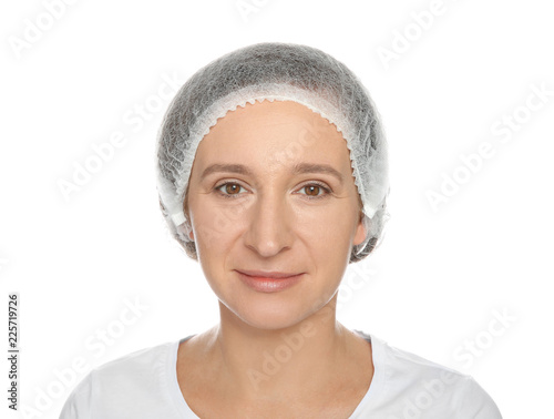 Portrait of mature woman preparing for cosmetic surgery on white background