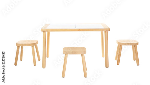 Wooden table and stools for kids isolated on white