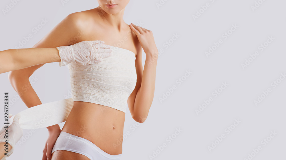 The concept of plastic surgery on the chest of a woman. The concept of plastic surgery on the chest of a woman.