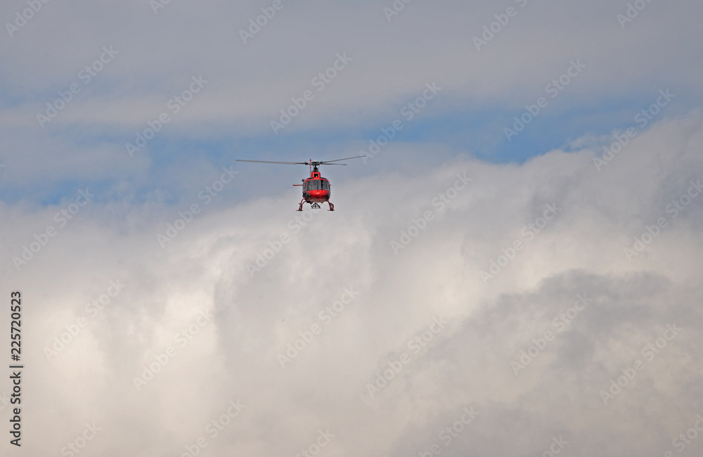 helicopter in flight through the clouds