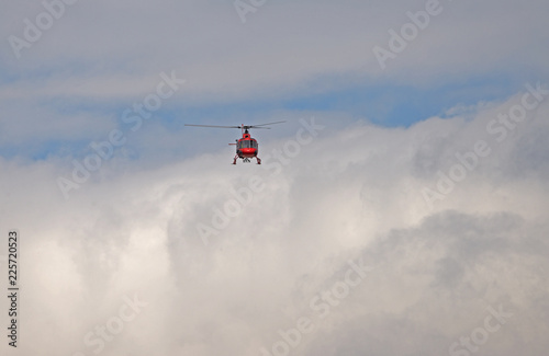 helicopter in flight through the clouds