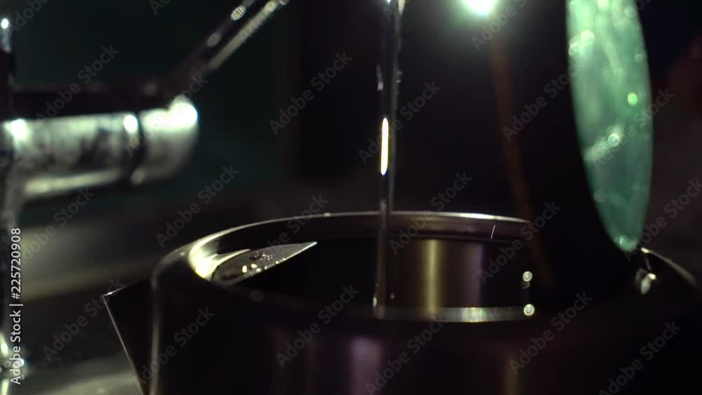 Glass electric kettle pouring water at the kitchen Glass electric kettle pouring water at the kitchen