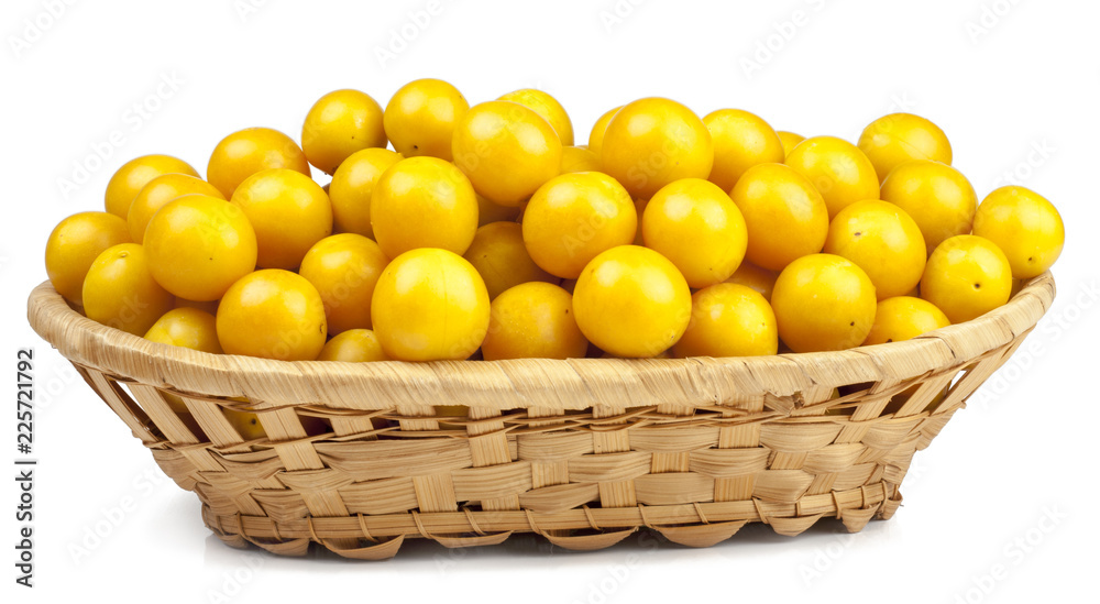 Cherry plums in basket isolated on white Cherry plums in basket isolated on white