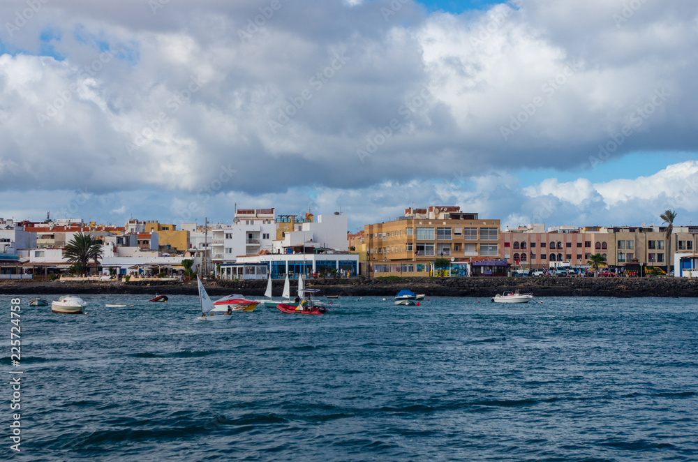 the port of Corralejo, a lively Canarian town overlooking the ocean.