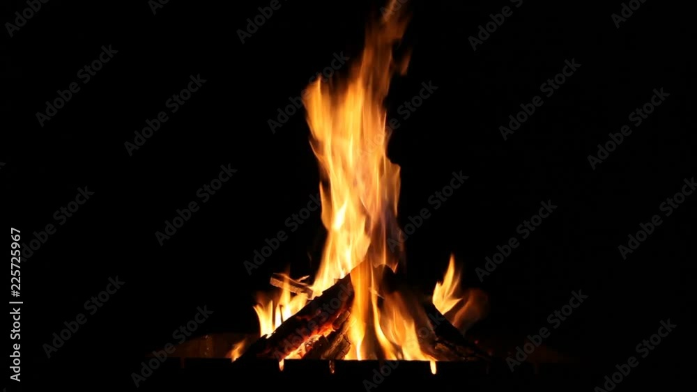 Fire on a black background in the grill. Fire on a black background in the grill.