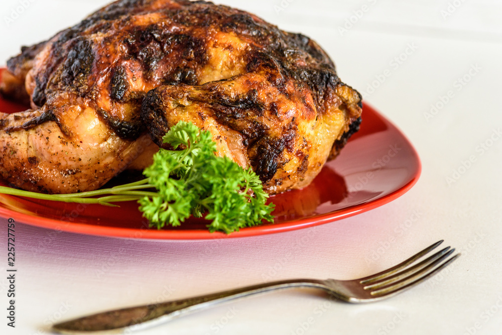 grilled chicken on a red plate grilled chicken on a red plate