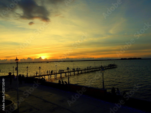 Orange sunsent and the dock in the bay