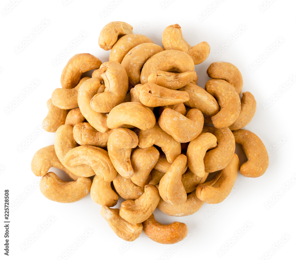 Pile of fried cashew on a white, isolated. The view from the top. Pile of fried cashew on a white, isolated. The view from the top.