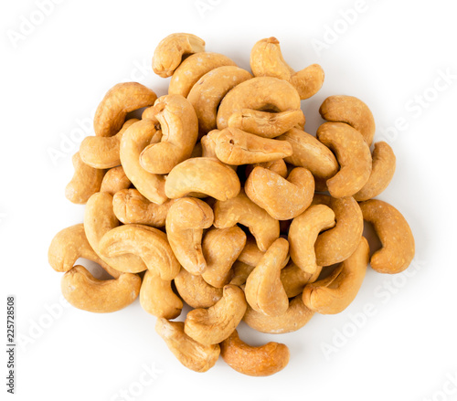 Pile of fried cashew on a white, isolated. The view from the top.