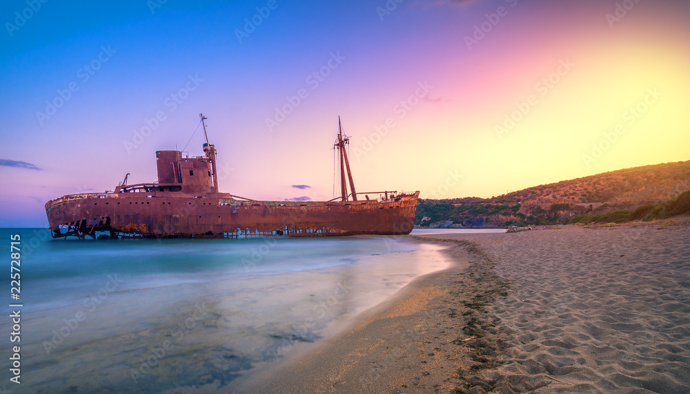 Greek coastline with the famous rusty shipwreck in Glyfada beach near Gytheio, Gythio Laconia Peloponnese Greece. Greek coastline with the famous rusty shipwreck in Glyfada beach near Gytheio, Gythio Laconia Peloponnese Greece.