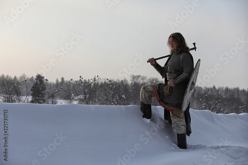 Defender the young warrior in mail armor photo