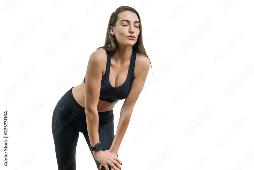 Young woman runner in black sportswear, isolated on white background, copy space Young woman runner in black sportswear, isolated on white background, copy space