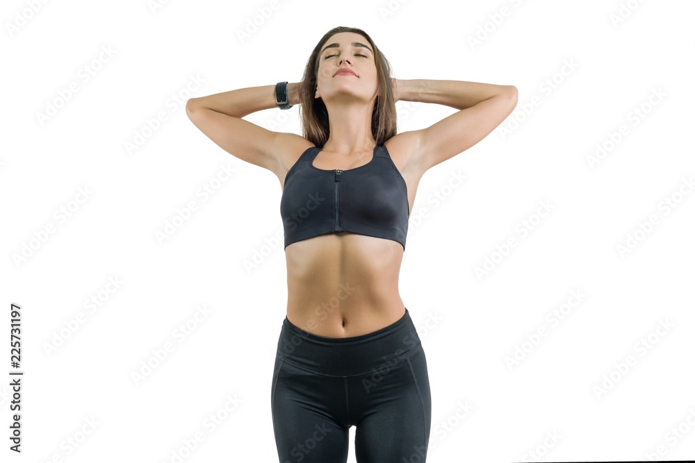 Young woman enjoys sports eyes closed, in black sportswear, isolated on white background Young woman enjoys sports eyes closed, in black sportswear, isolated on white background