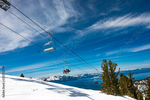 Lake Tahoe from Heavenly Resort - skiing - looking at ski lift with lake in background - space for text top right © Larry Zhou