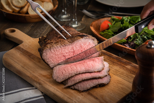 slicing roast beef photo