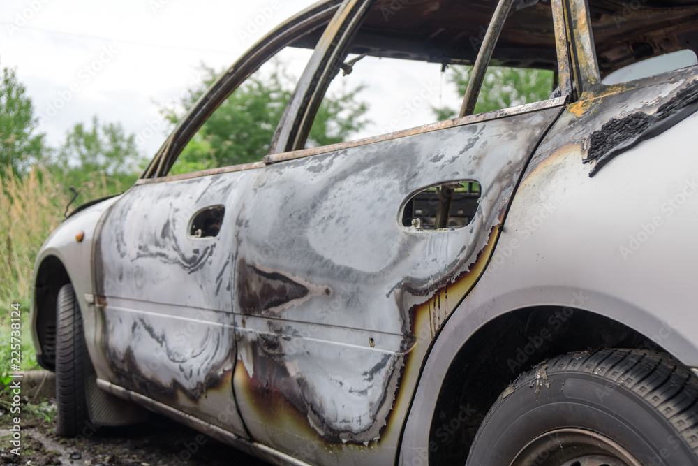 Burned out car after a car accident. Outside view. Burned out car after a car accident. Outside view.