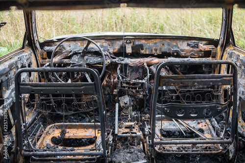 Burned out car after a car accident. Inside view.