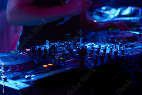DJ hands on equipment